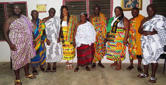 visitors wearing Kente with chiefs in Ghana