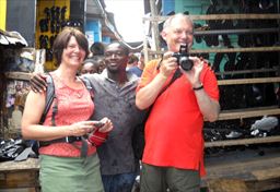 visitors taking pictures at Kejetia Market