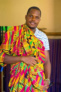 handsome man wearing Kente at Adanwomase