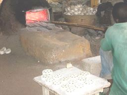 Visitor shopping for carvings in Ghana