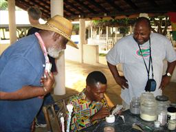 Guests watching bead making