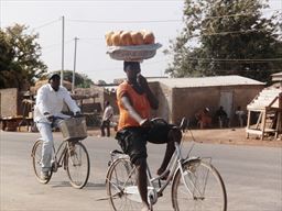 Bread seller on bicycle
