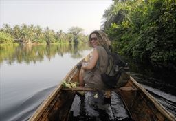 Guest on Volta River with canoe