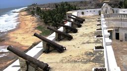 cannons of Cape Coast Castle above beach