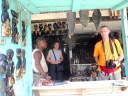 Visitor shopping for carvings in Ghana