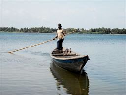 Fisherman in canoe Volta River