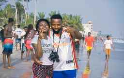 friends posing for the camera at the beach