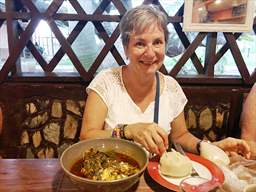 Woman eating banku