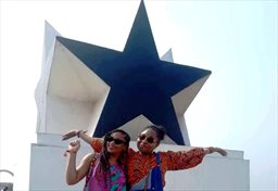 Guests posing atop Black Star Gate in Accra