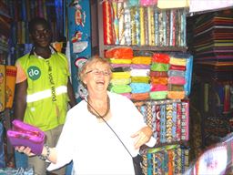 Visitor buying cloth in Ghana