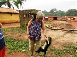 guest playing with monkey