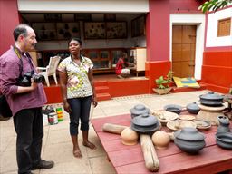 photographer at pottery display at Kumasi Centre for National Culture