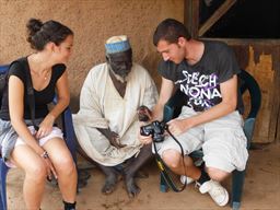 Guests sharing photo with village chief