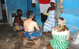 Guests receiving a traditional blessing in Ghana