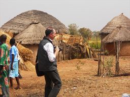 Visitor taking pictures in a village in northern Ghana