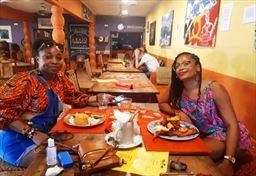 Visitors at upscale restaurant in Ghana