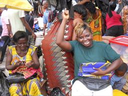 Woman buying cloth at Kejetia market