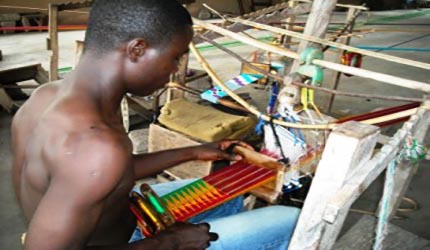 weaving Kente cloth in Ghana